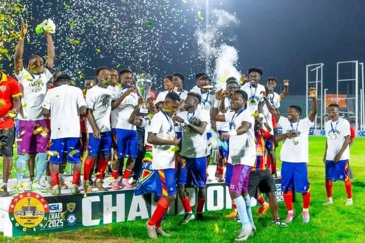 Hearts of Oak celebrating with the trophy and confetti