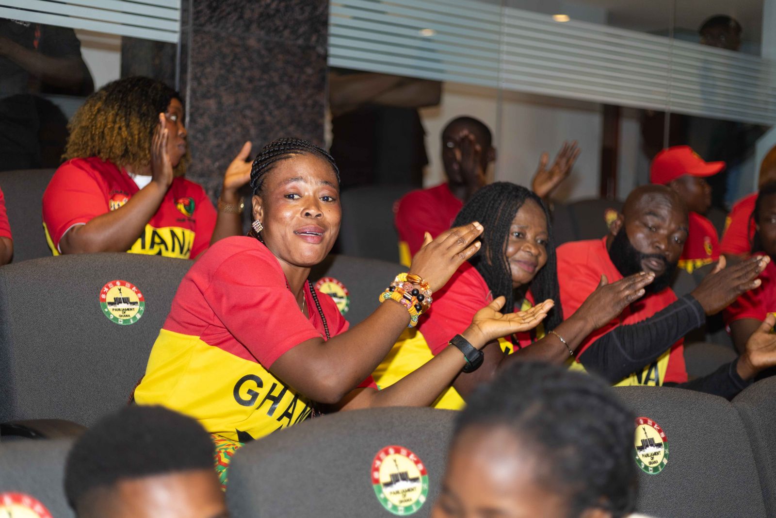 Supporters applauding in Ghana jerseys