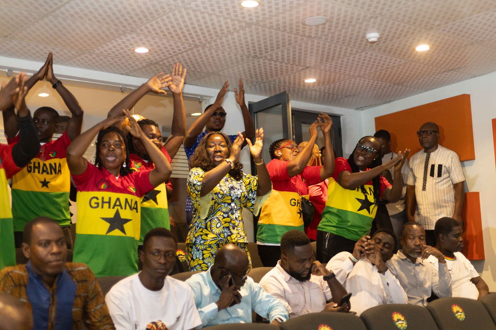 Supporters celebrating in Ghana jerseys